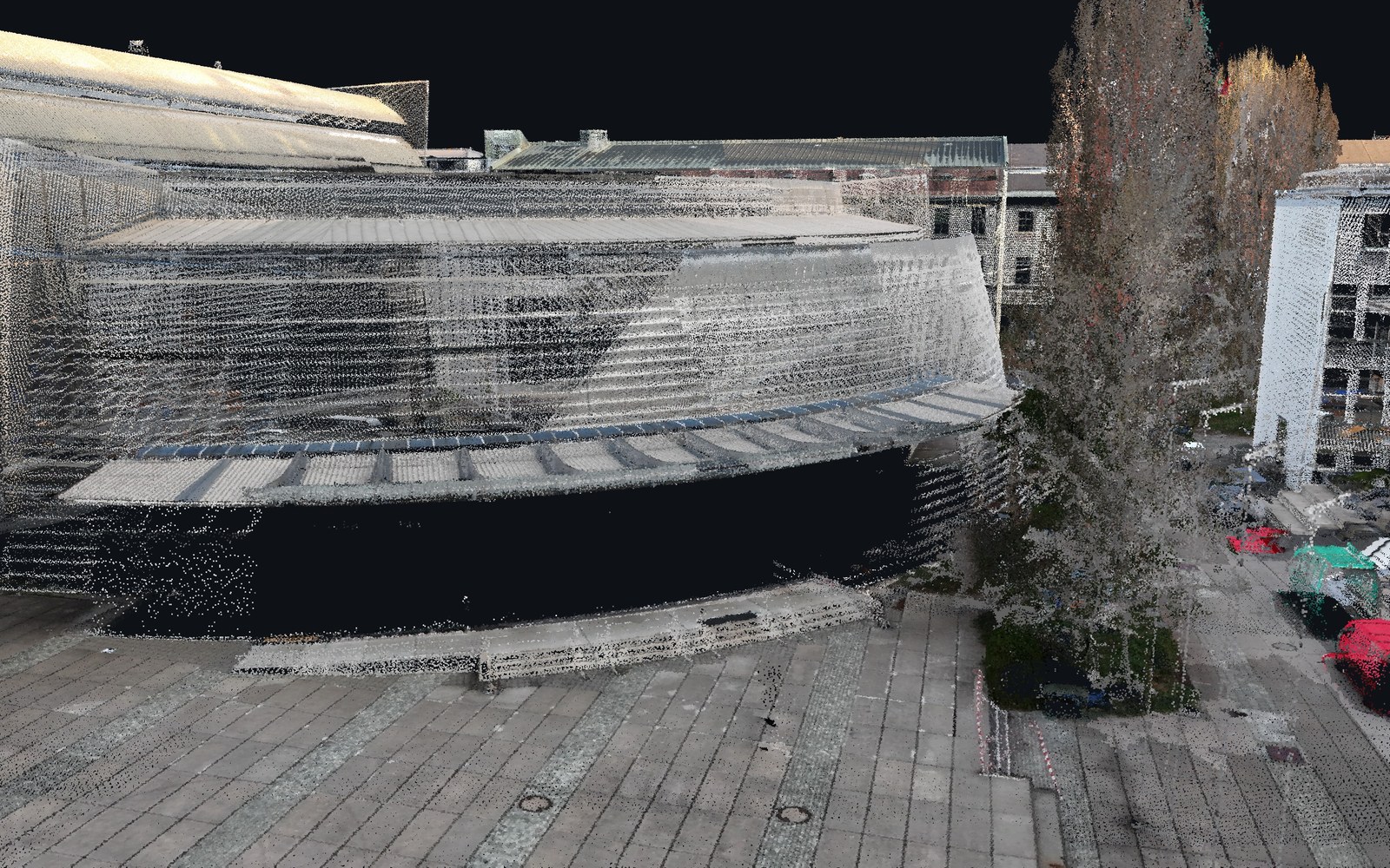 Building facade in the coloured point cloud using vertical imagery only: walls are dark and sparsely coloured